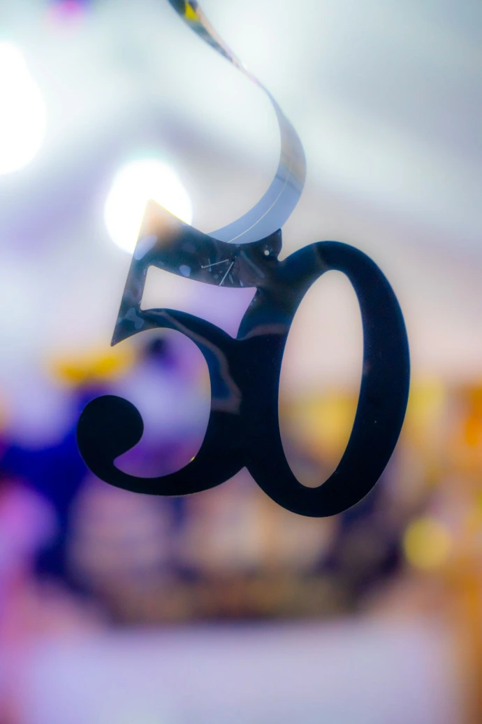 A close up of the number sixty hanging from a ceiling